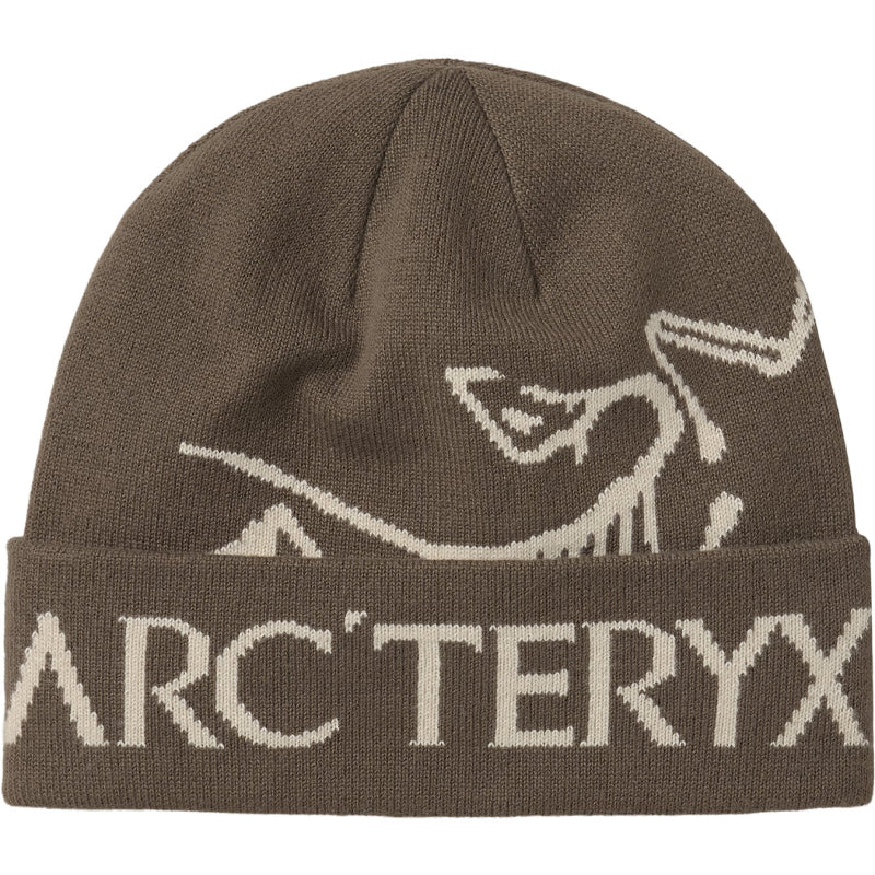 A brown knit beanie hat featuring a cream-colored Arc'teryx bird logo and the brand name 'ARC'TERYX' knitted onto the folded cuff, shown against a plain white background.
