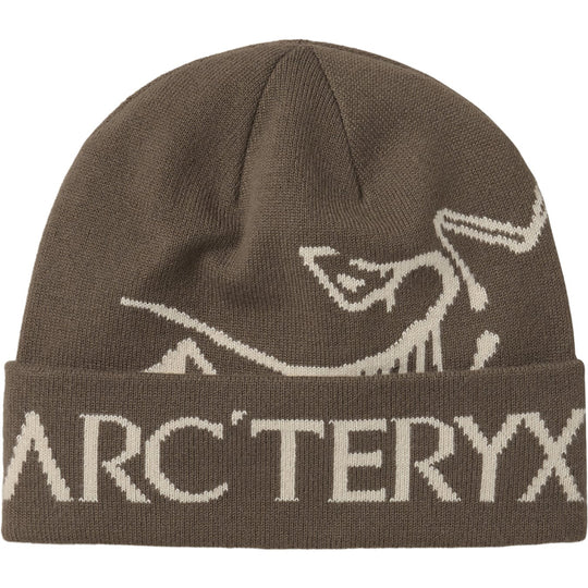 A brown knit beanie hat featuring a cream-colored Arc&