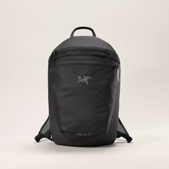 Black backpack on a beige background