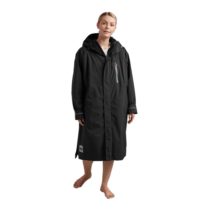 Person wearing a black raincoat on a white background