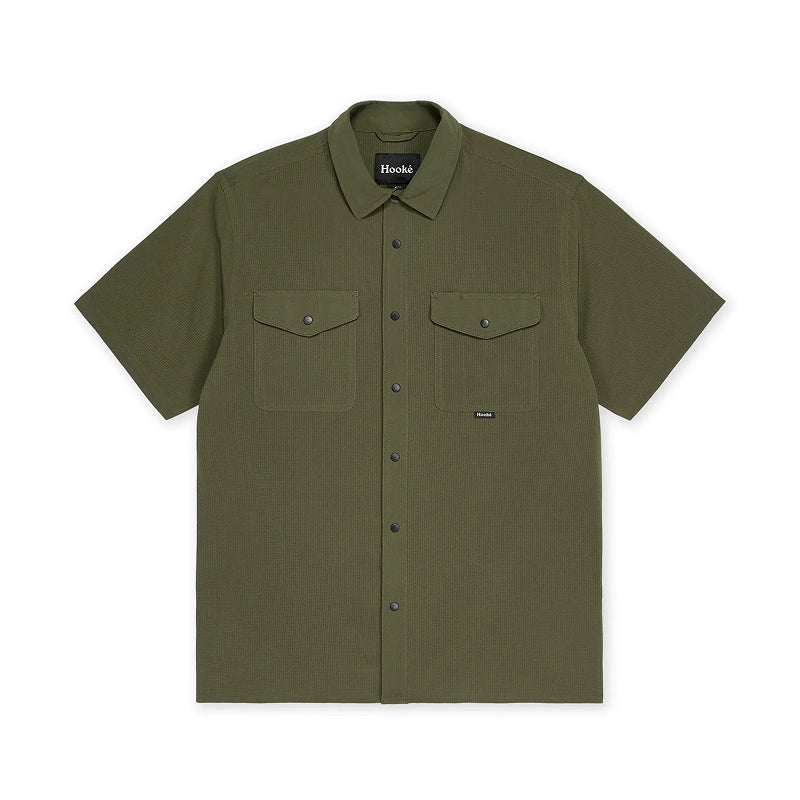 Green short-sleeve shirt with two front pockets on a white background