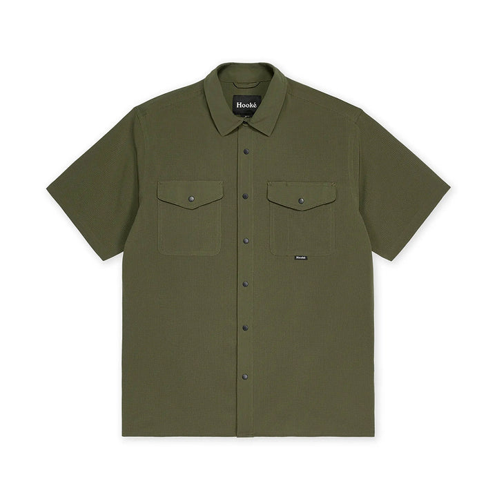 Green short-sleeve shirt with two front pockets on a white background
