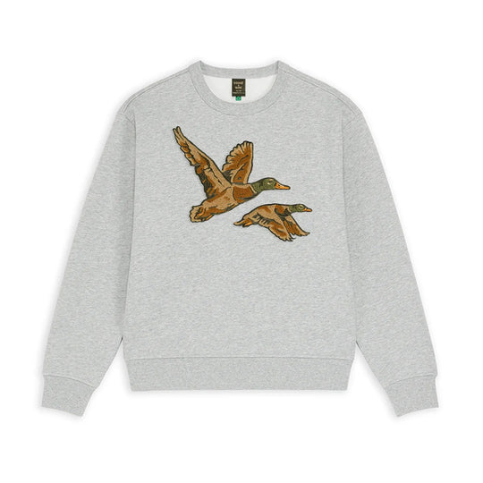 A light heather gray crewneck sweatshirt featuring a graphic print of two flying mallards on the chest, displayed against a solid white background.
