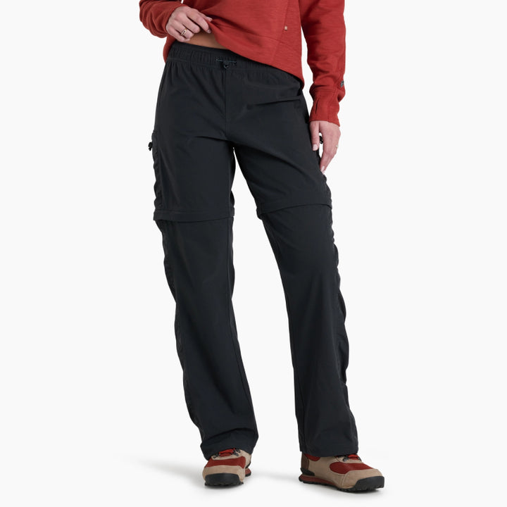 Person wearing black pants on a white background