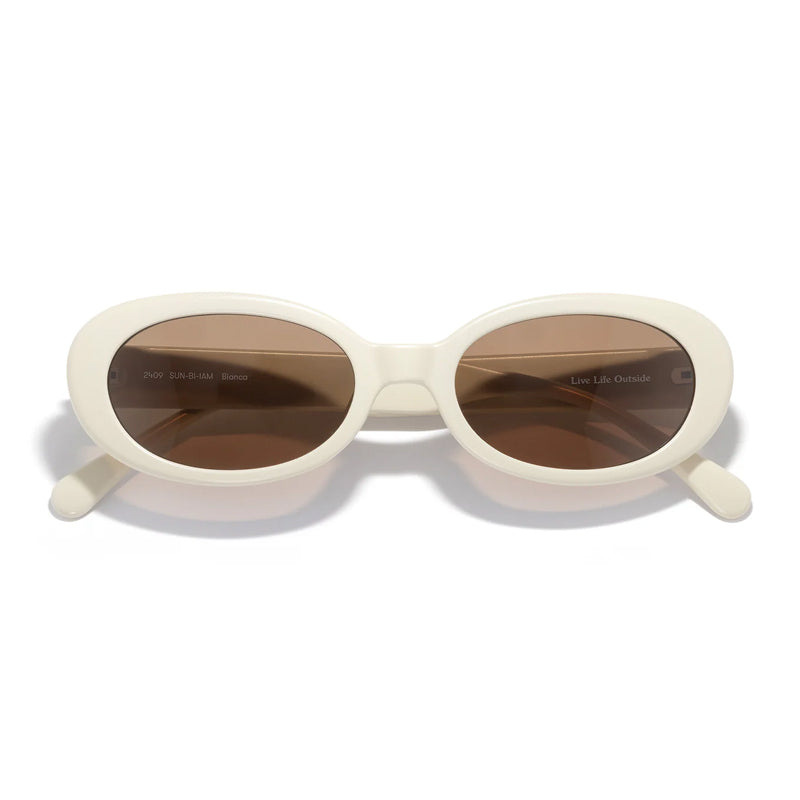 White sunglasses with brown lenses on a white background