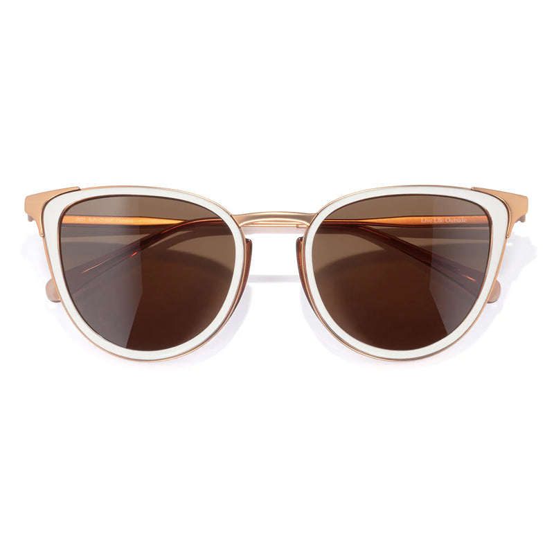 Sunglasses with brown lenses and gold frame on a white background