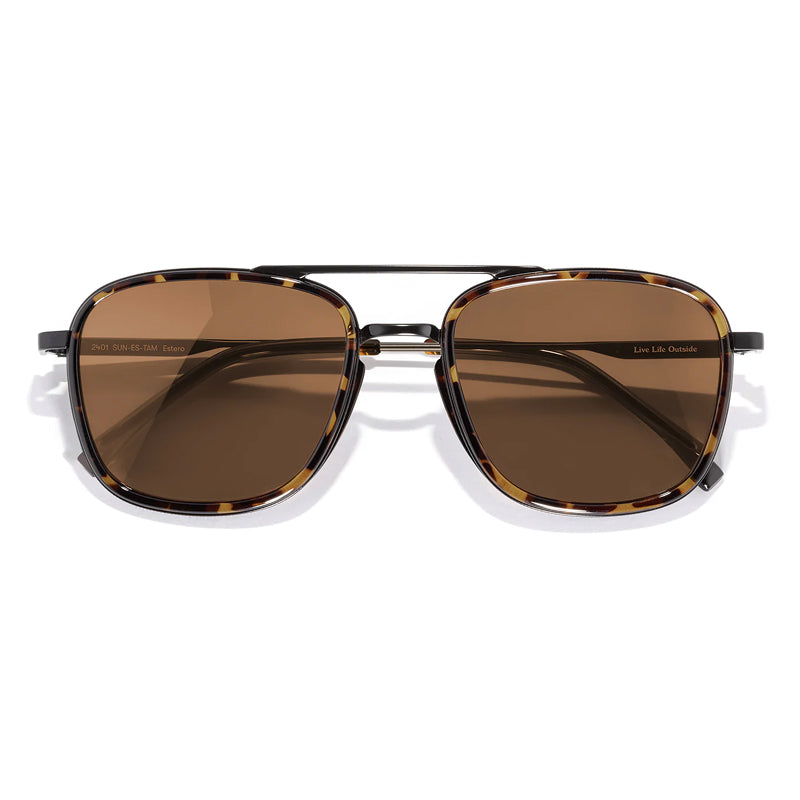 Sunglasses with brown lenses and gold frame on a white background