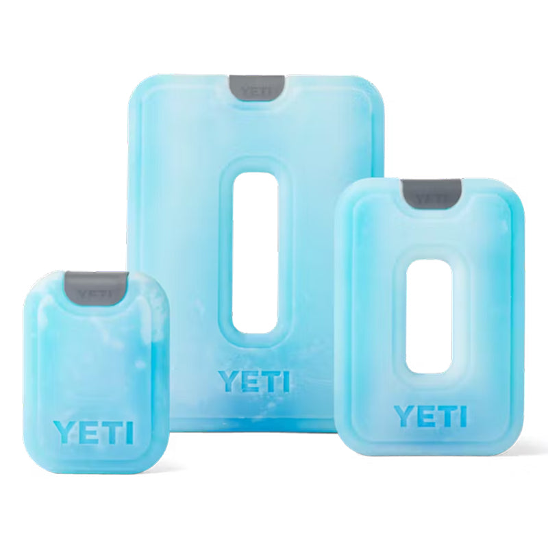Three blue silicone ice packs with 'YETI' branding on a white background